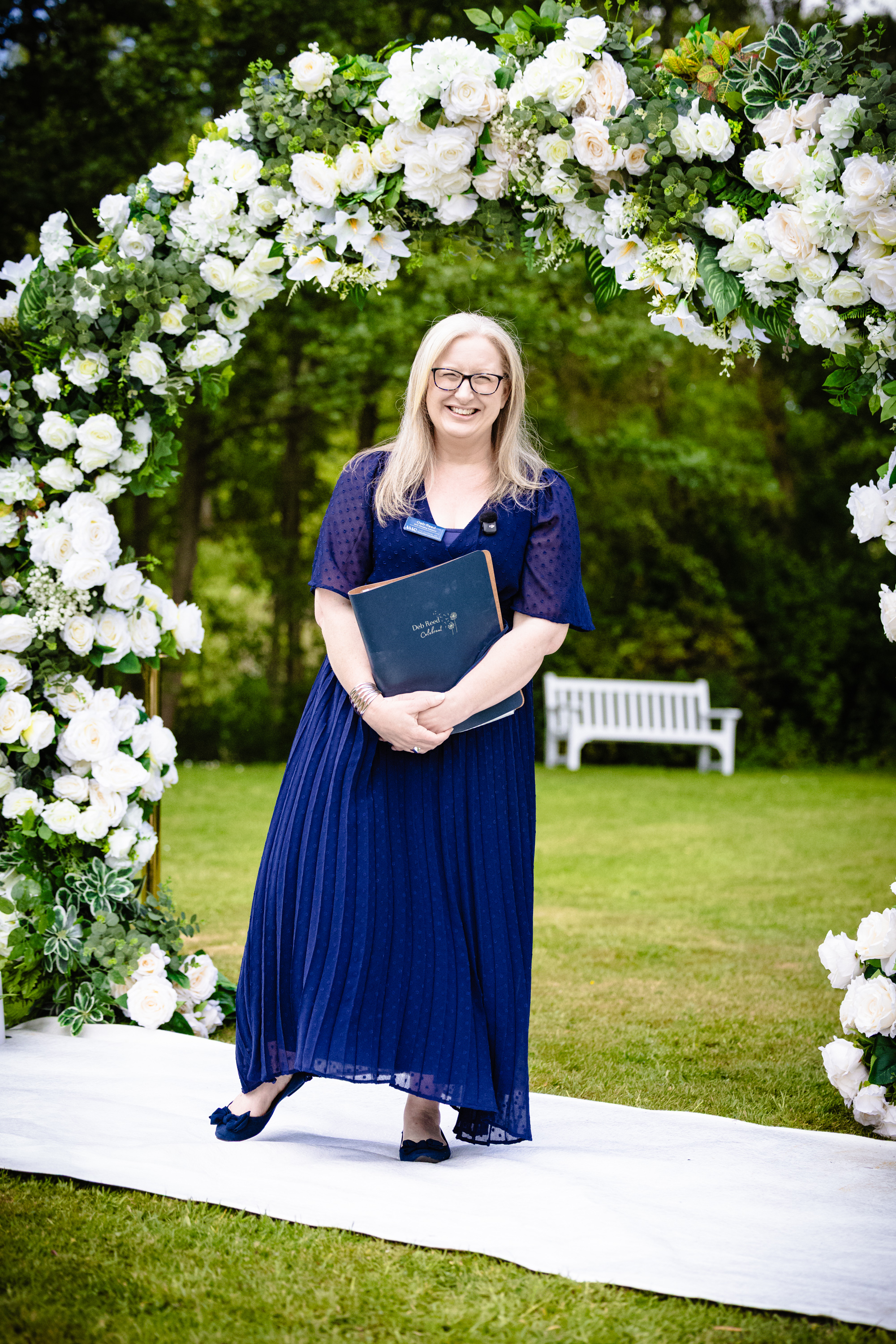 Deb Reed Celebrant Essex Colchester posing with arms out smiling.
